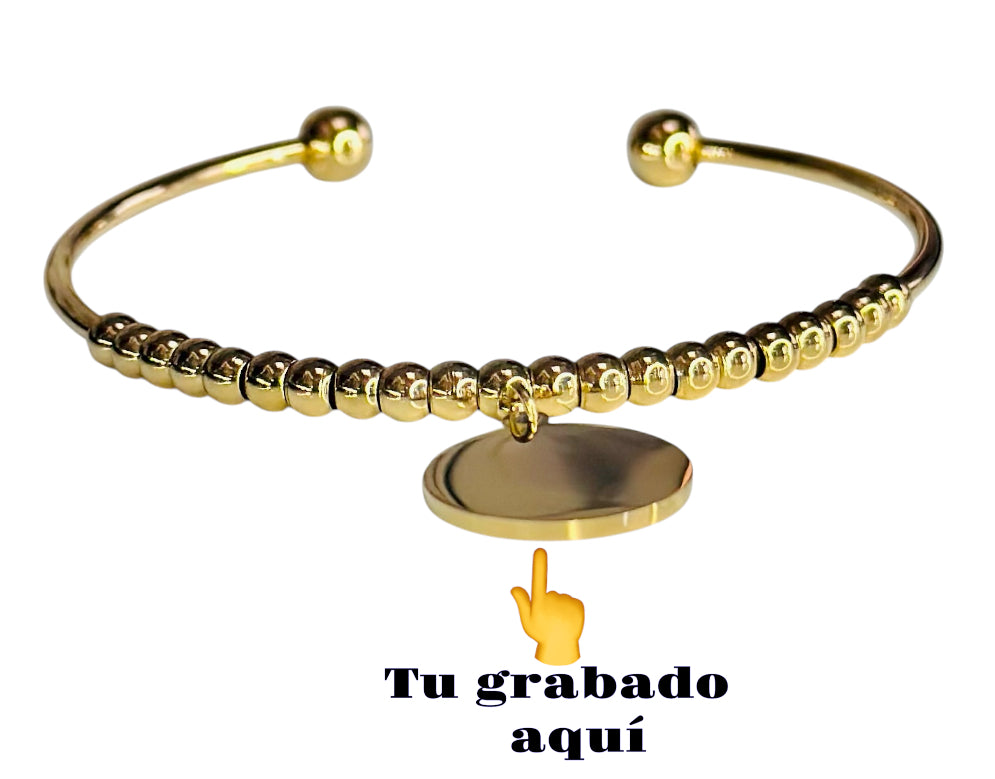Pulsera dorada con bolitas