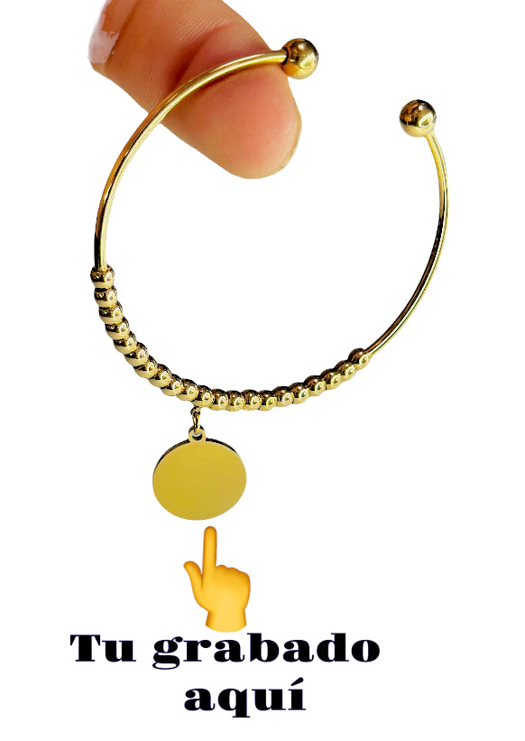 Pulsera dorada con bolitas
